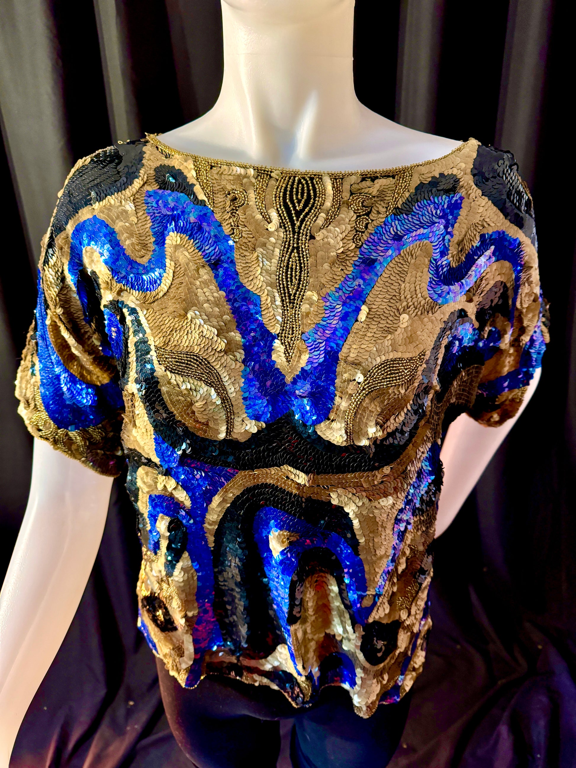 Front View on Mannequin:  Oleg Cassini vintage top. 100% black silk shell with hand sewn sequins, black rayon lining. Hand wash only.