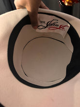 Charger l&#39;image dans la galerie, Label of Authenticity for Mr John Jr located inside on the hat band in black. The tag shows “Mr John” embroidered in black and “Jr” in red as marked on hits hats from the 1960s

