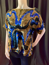 Lade das Bild in den Galerie-Viewer, Oleg Cassini art nouveau- inspired swirling abstract design boatneck sequined top with short sleeves, size M. Color combination is gold, black and blue
