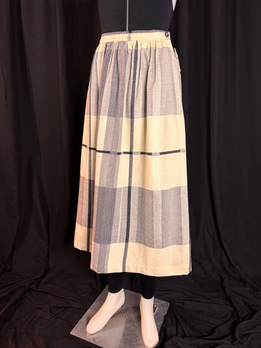 3/4 view Evan-Picone full length skirt, 32 inches long. Windowpane plaid in creamy white, black and grey. It is gathered at the waist and wide at the hem. Timeless and elegant 