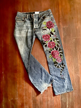 Load image into Gallery viewer, Full view of King Snake in Roses jeans with distressed hem visible. 
