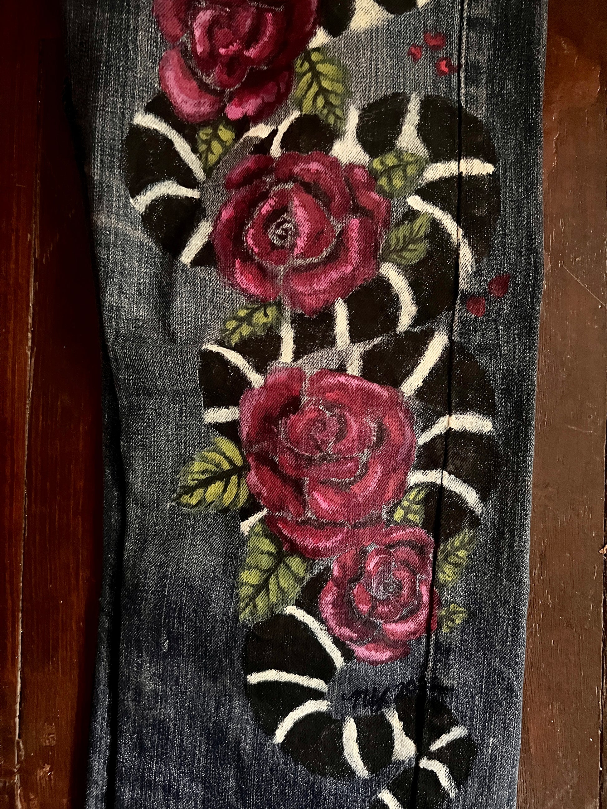 Front view, lower left leg of King Snake and Roses artwork with visible signature of Nicole Young