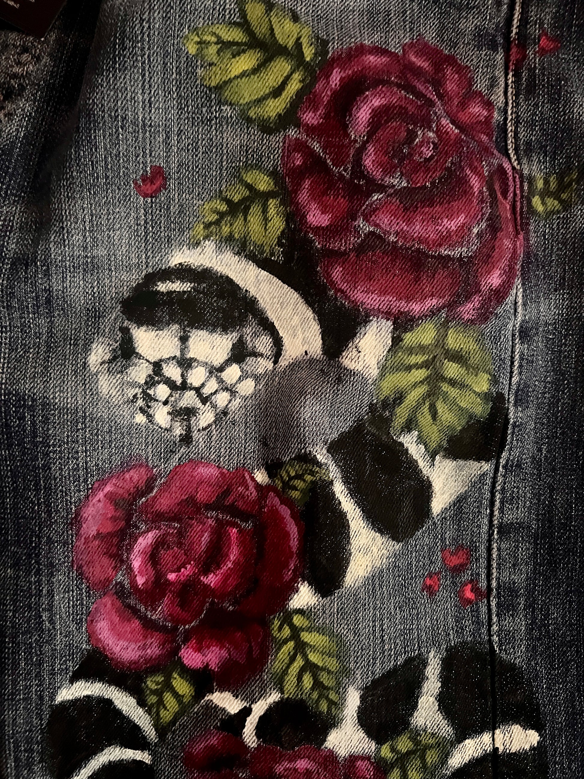 Close-up view of King Snake head and rose and leaves.