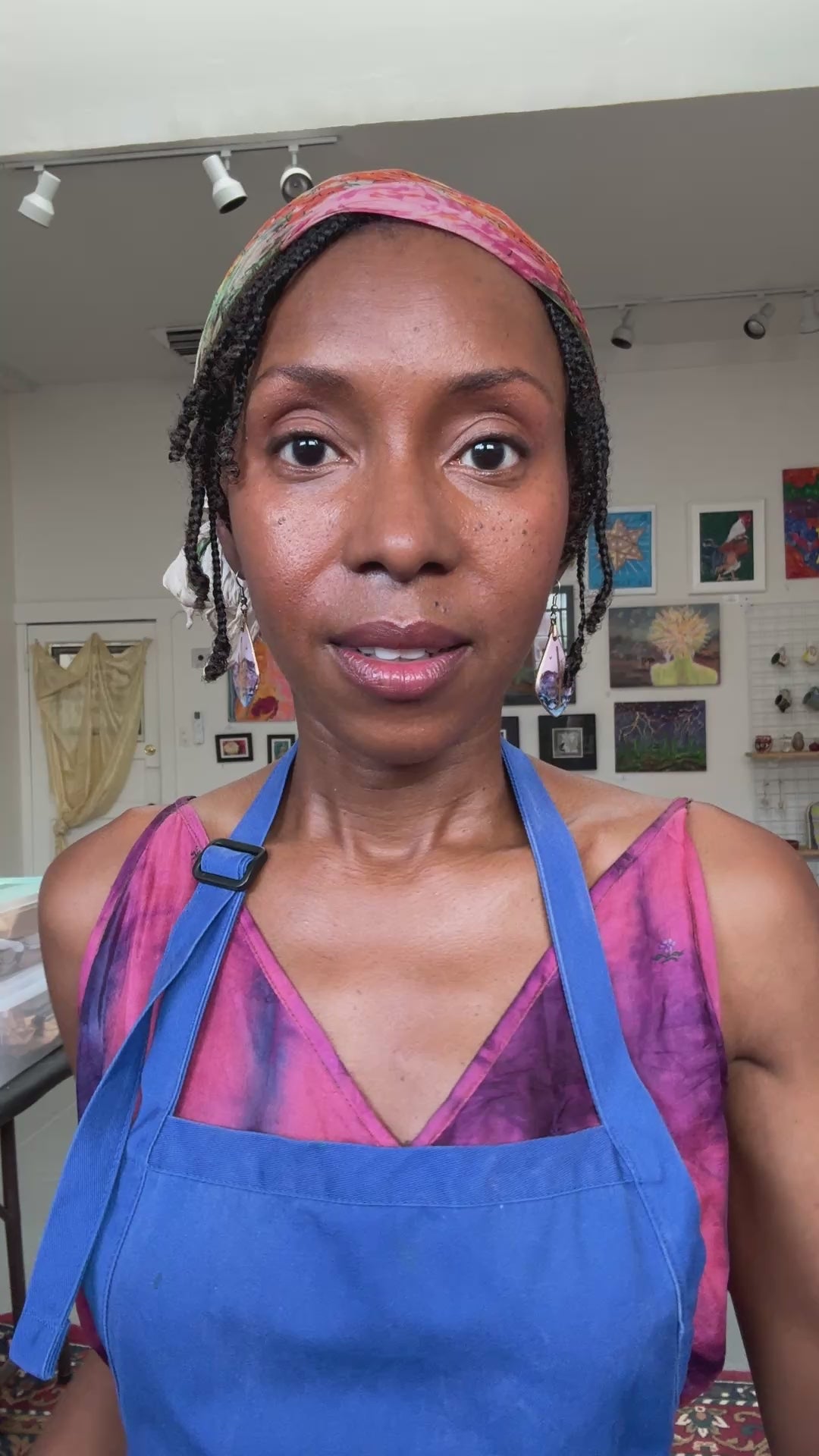 A video clip of Lali Nicole Young showing "Abstract" original painting in a gold vintage frame. She is speaking from her studio space at Temple Arts Collective.
